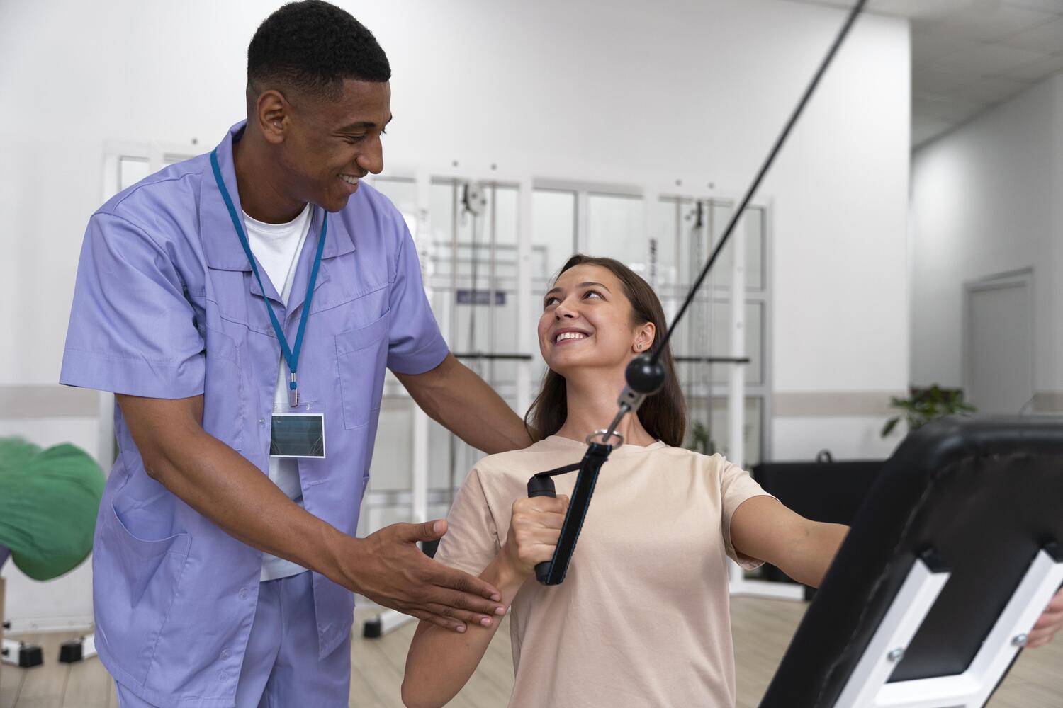 Medical Assistant Helping Patient With Physiotherapy Exercises at Core Concept